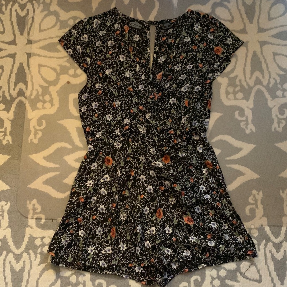 Black with floral pattern romper